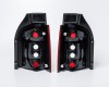 VW Transporter 03->09 aizmugures lukturis CRISTAL+LED balts/sarkans komplekts E